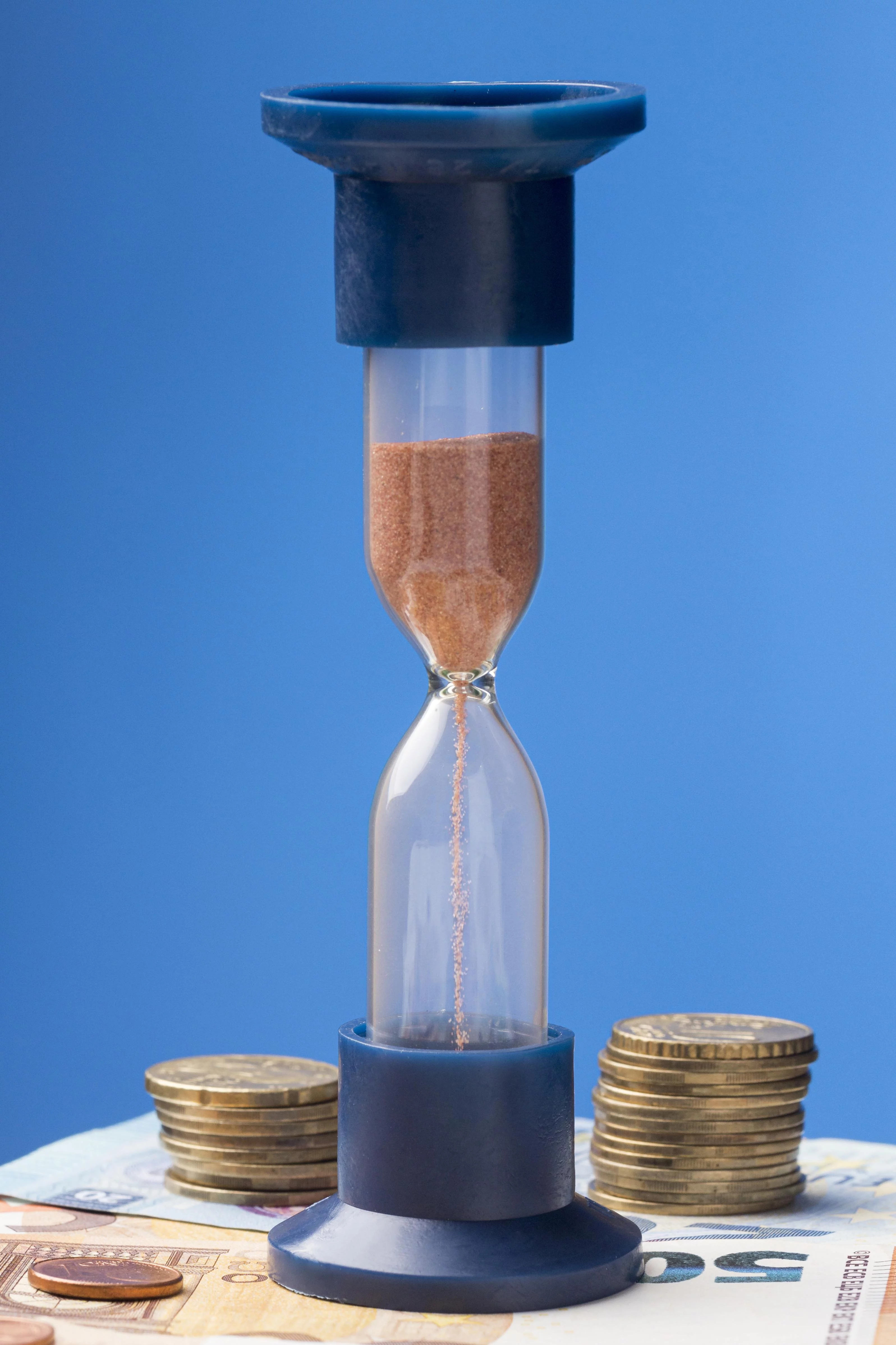 hourglass-pile-coins-arrangement.jpg